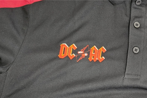 Black Talon Polo embroidered with logo in Orange color