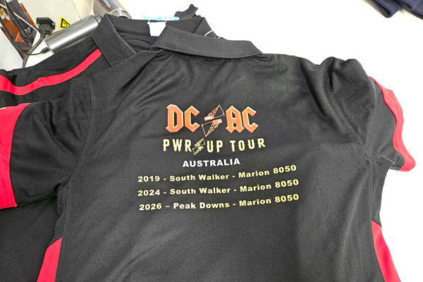 Black Talon polo printed on back with DTF printing