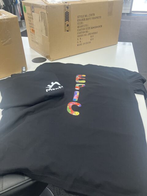 Custom black event T-shirts printed in Brisbane for Woodford Folk Festival